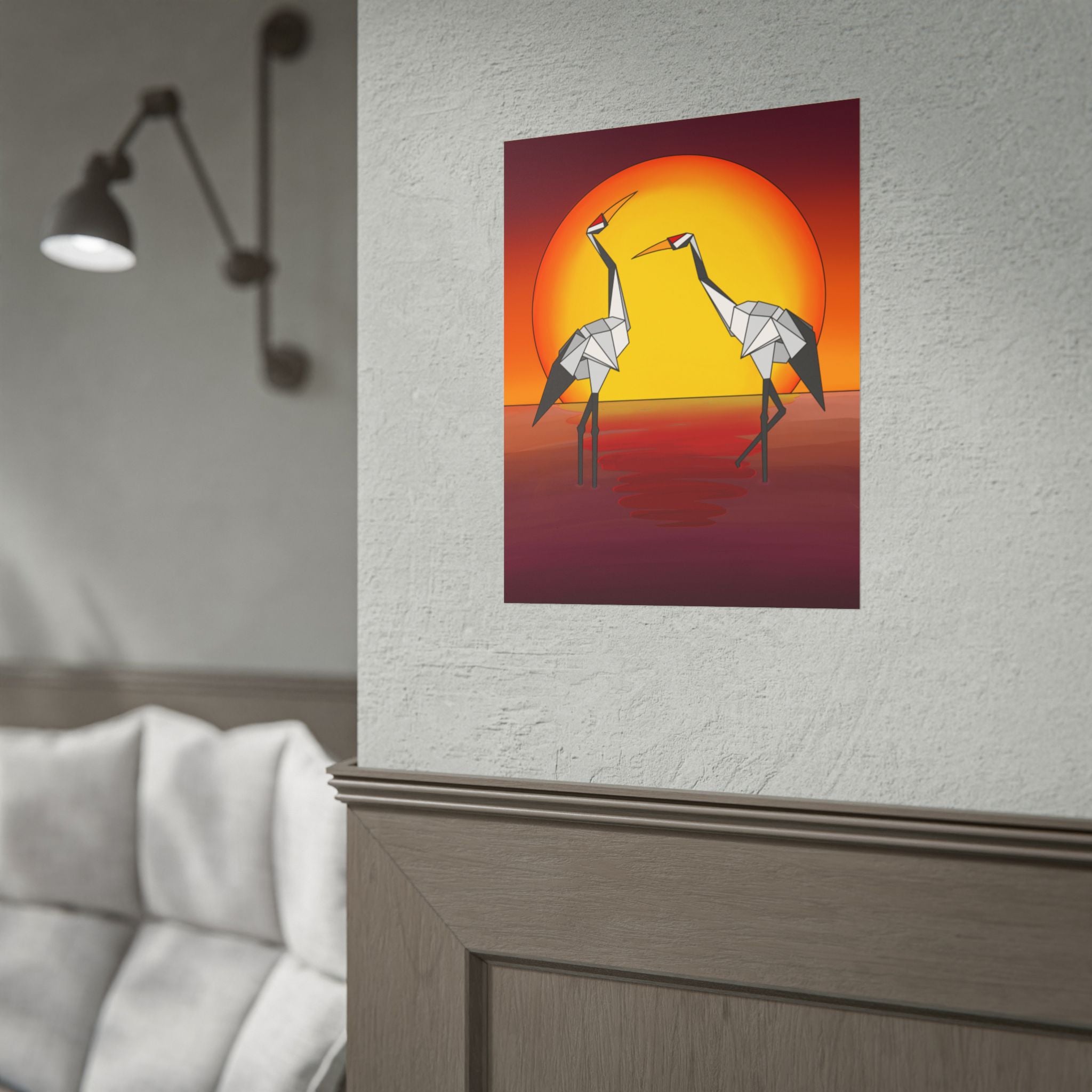Origami cranes sunset poster hanging on a wall, featuring two cranes and an orange sun
