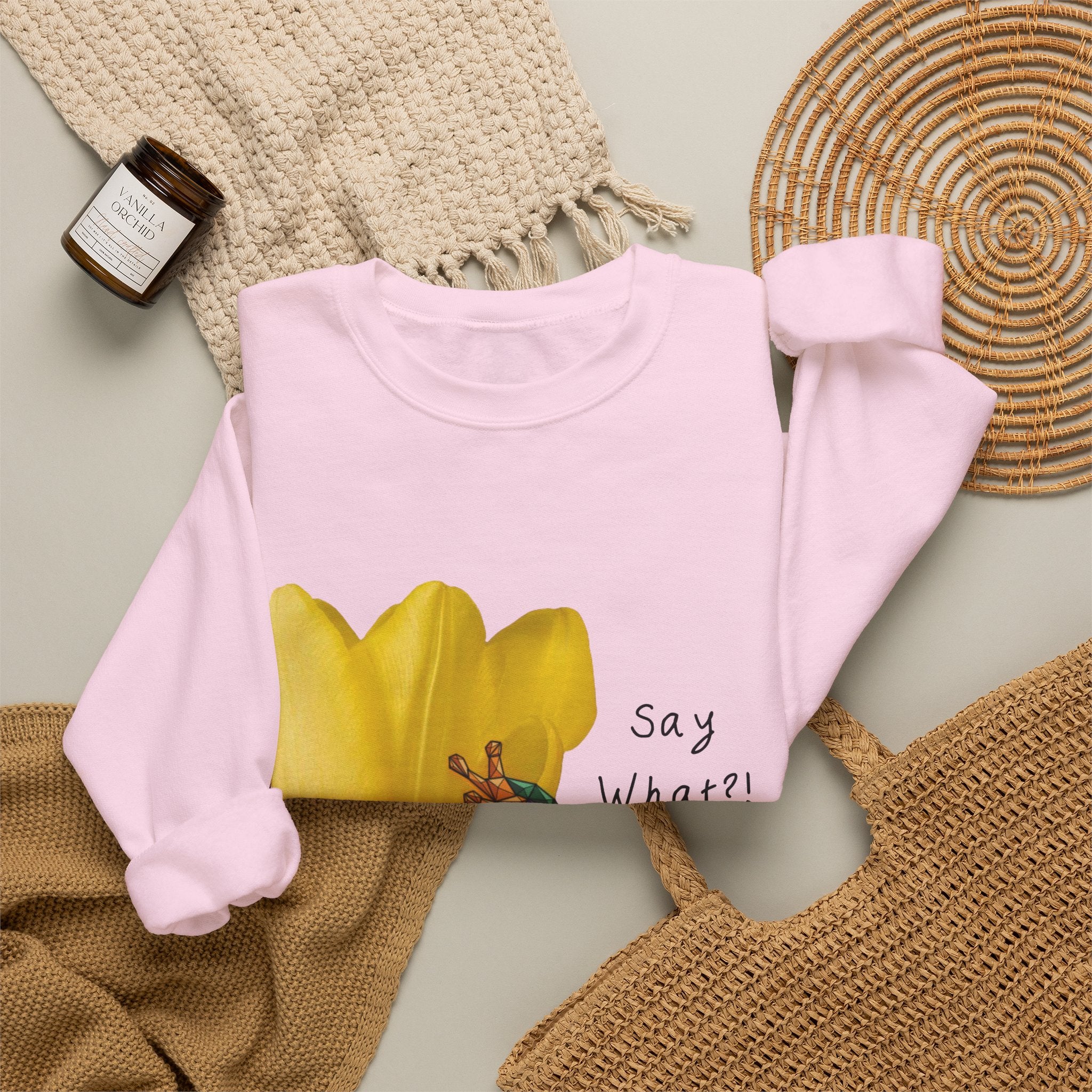 Light pink crewneck sweatshirt with yellow tulip frog graphic and “Say What?!” text