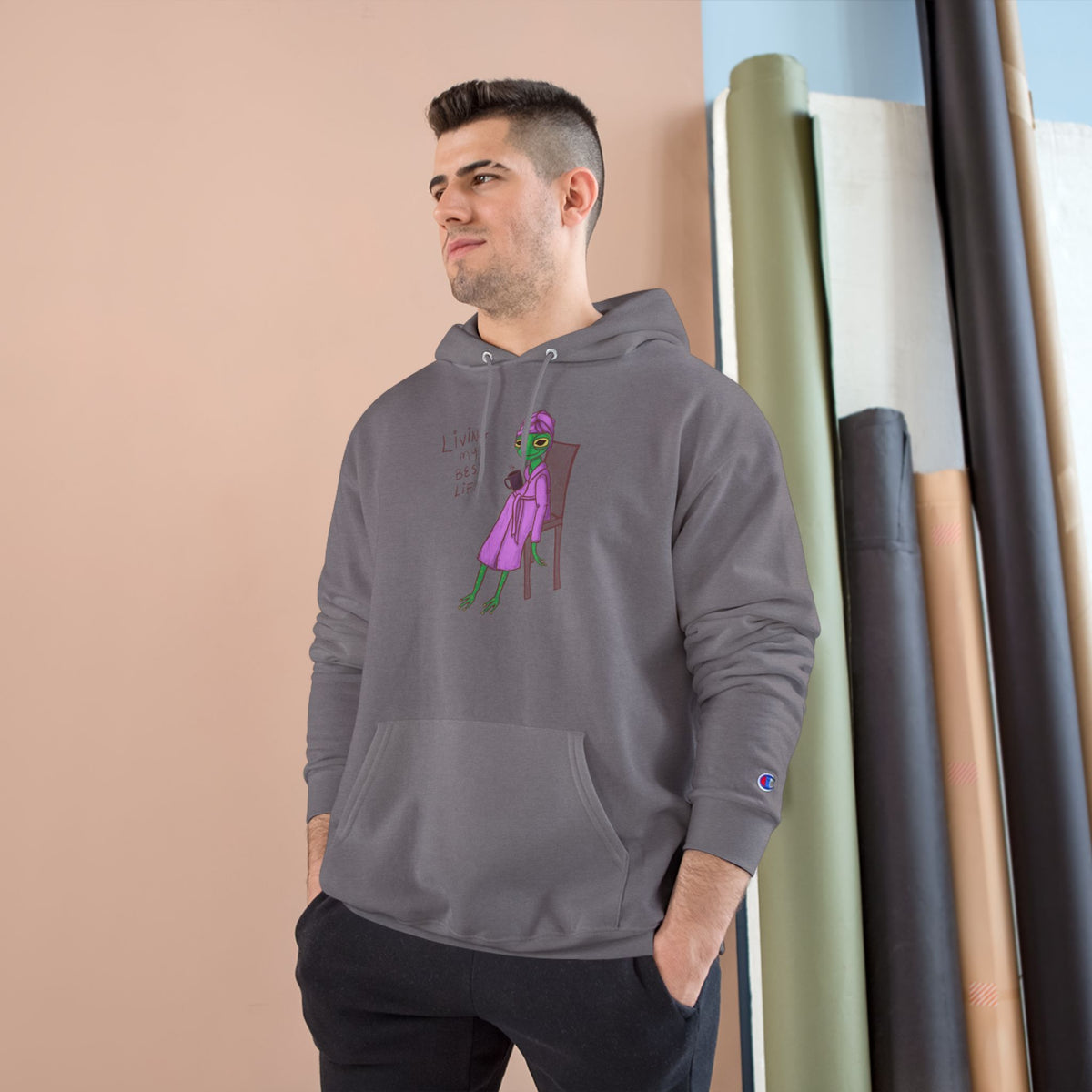 Gray unisex hoodie with hood, kangaroo pocket, long sleeves, and colorful front graphic