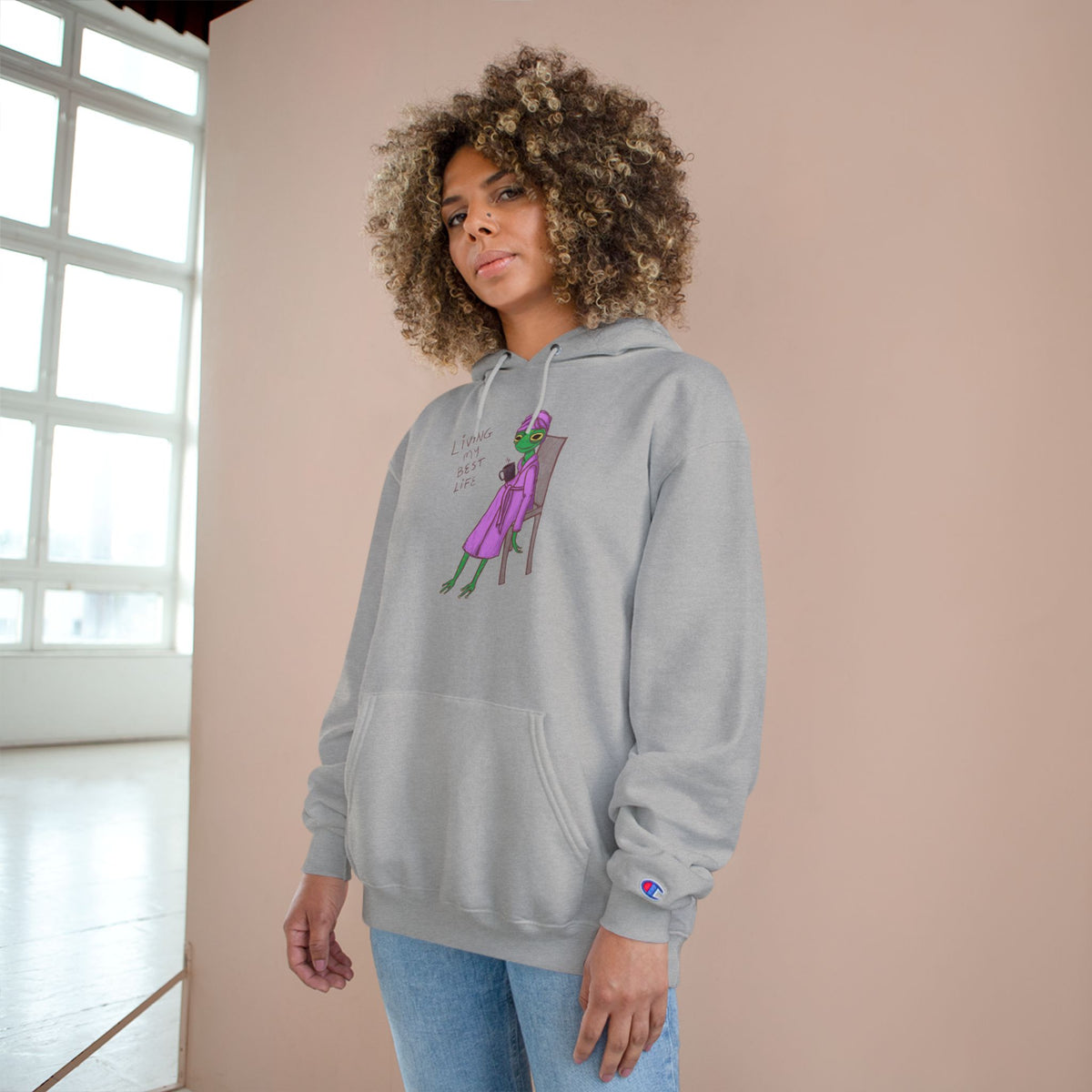 Light gray unisex hoodie with hood, kangaroo pocket, long sleeves, and colorful front graphic