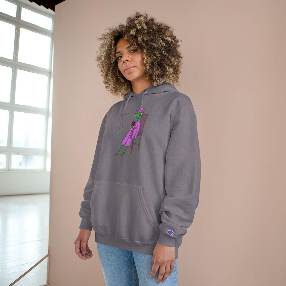 Light gray unisex hoodie with hood, kangaroo pocket, long sleeves, and colorful front graphic