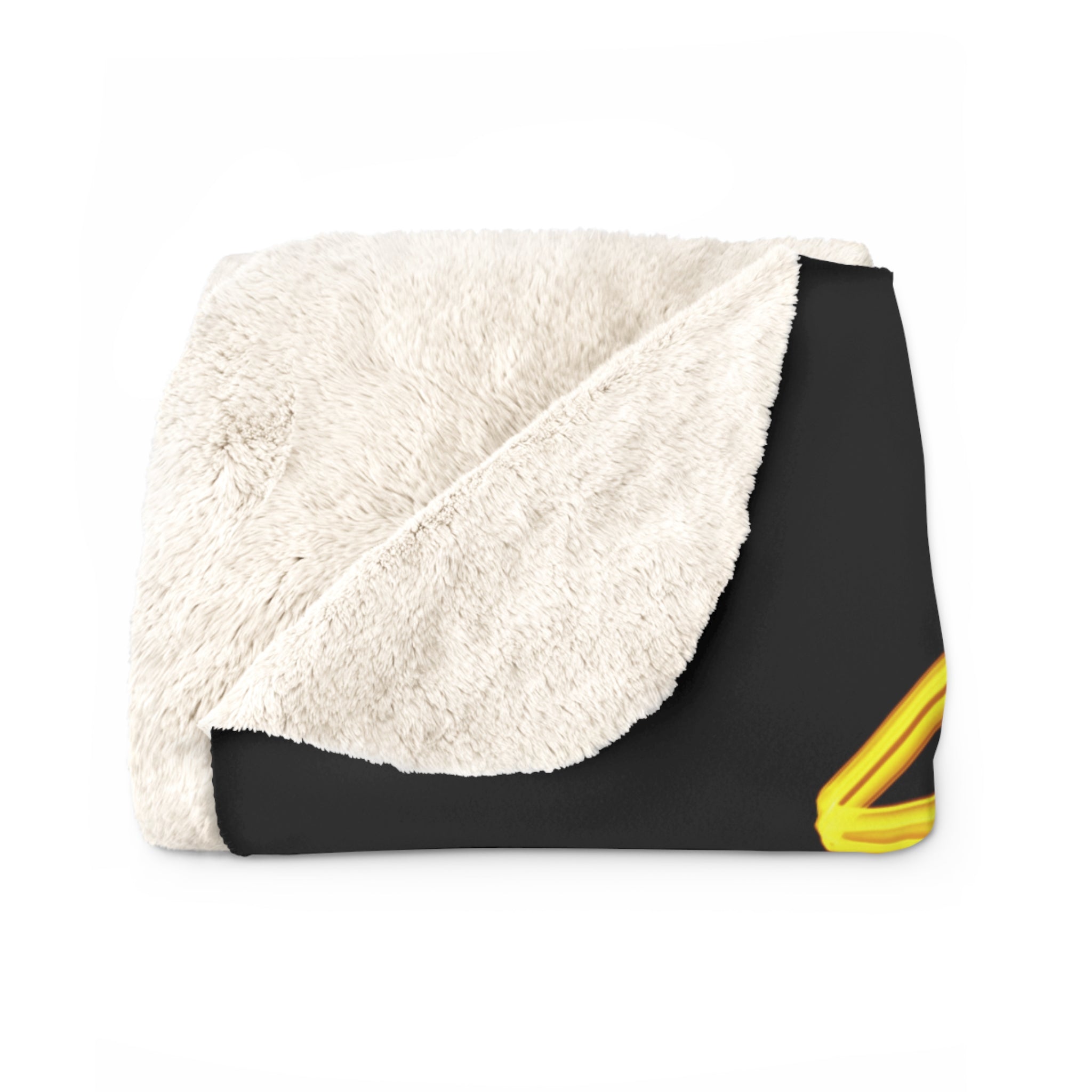 Folded sherpa fleece blanket with off-white plush side and black patterned edge