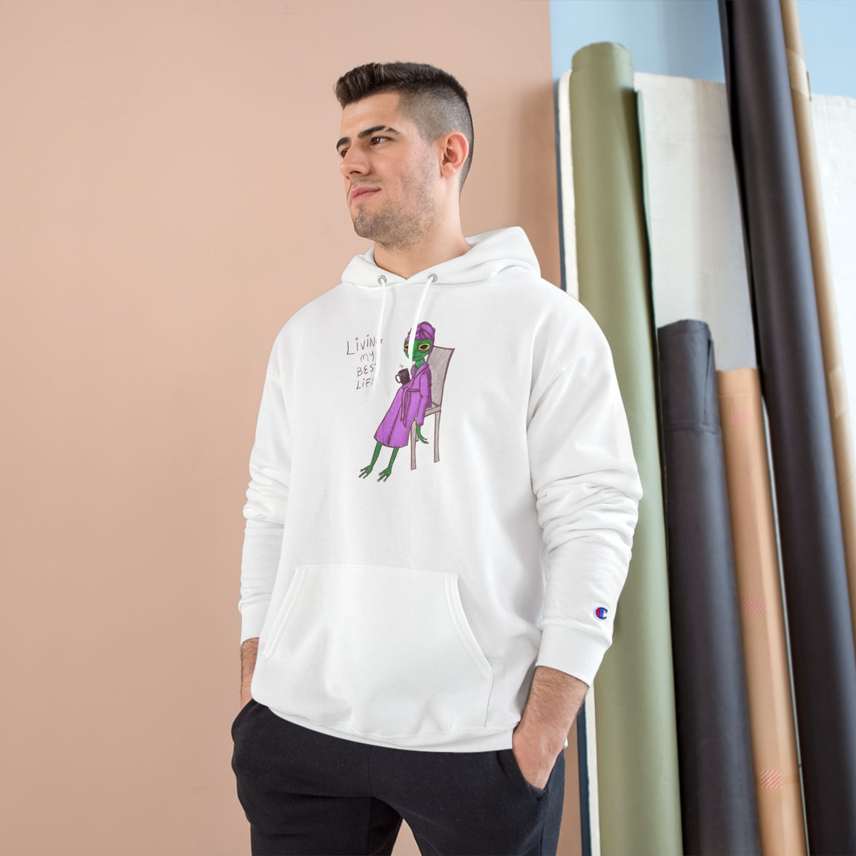 Unisex white hoodie worn by model, with character graphic on the chest