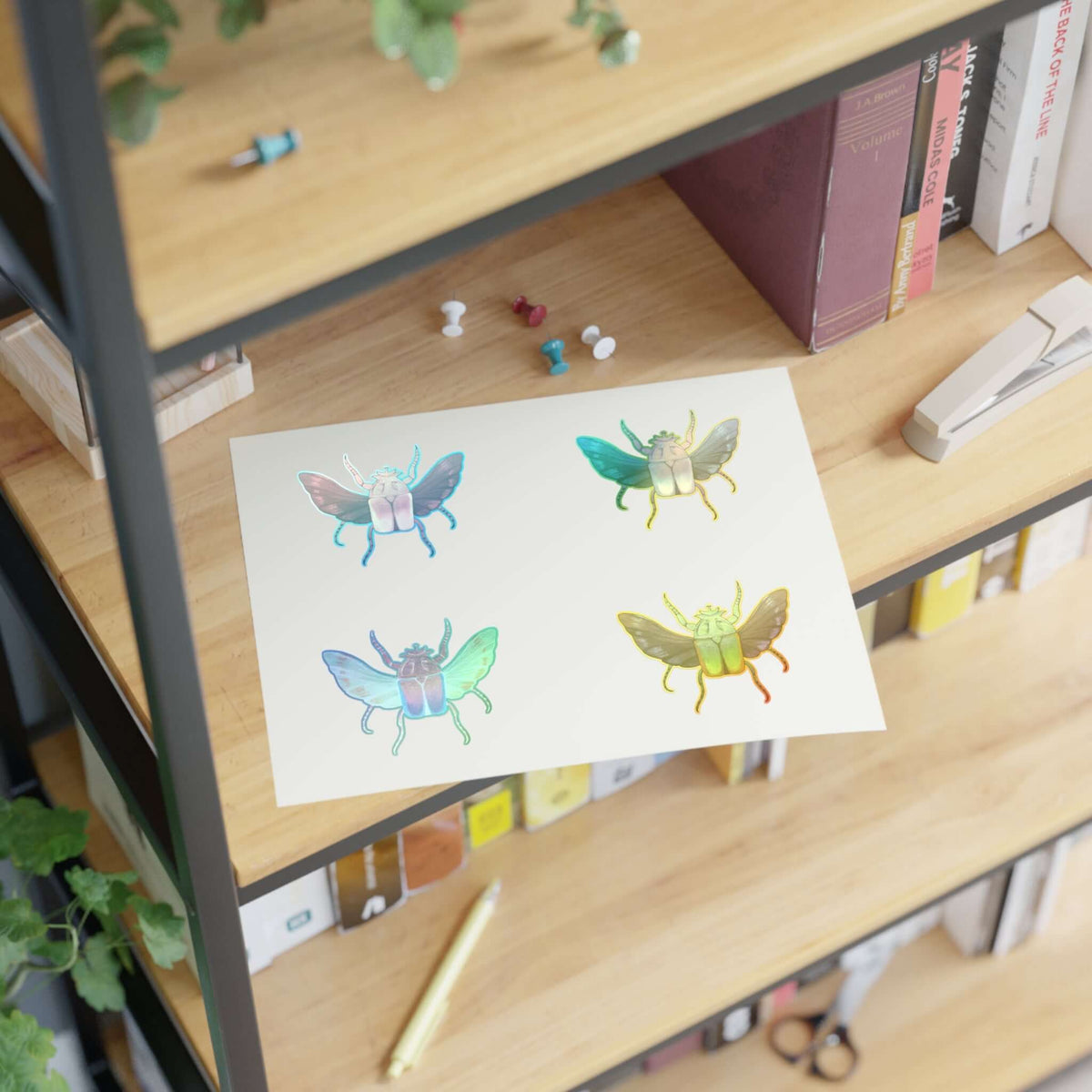 Sheet of die-cut colorful insect stickers, four butterfly-like bugs on white backing.