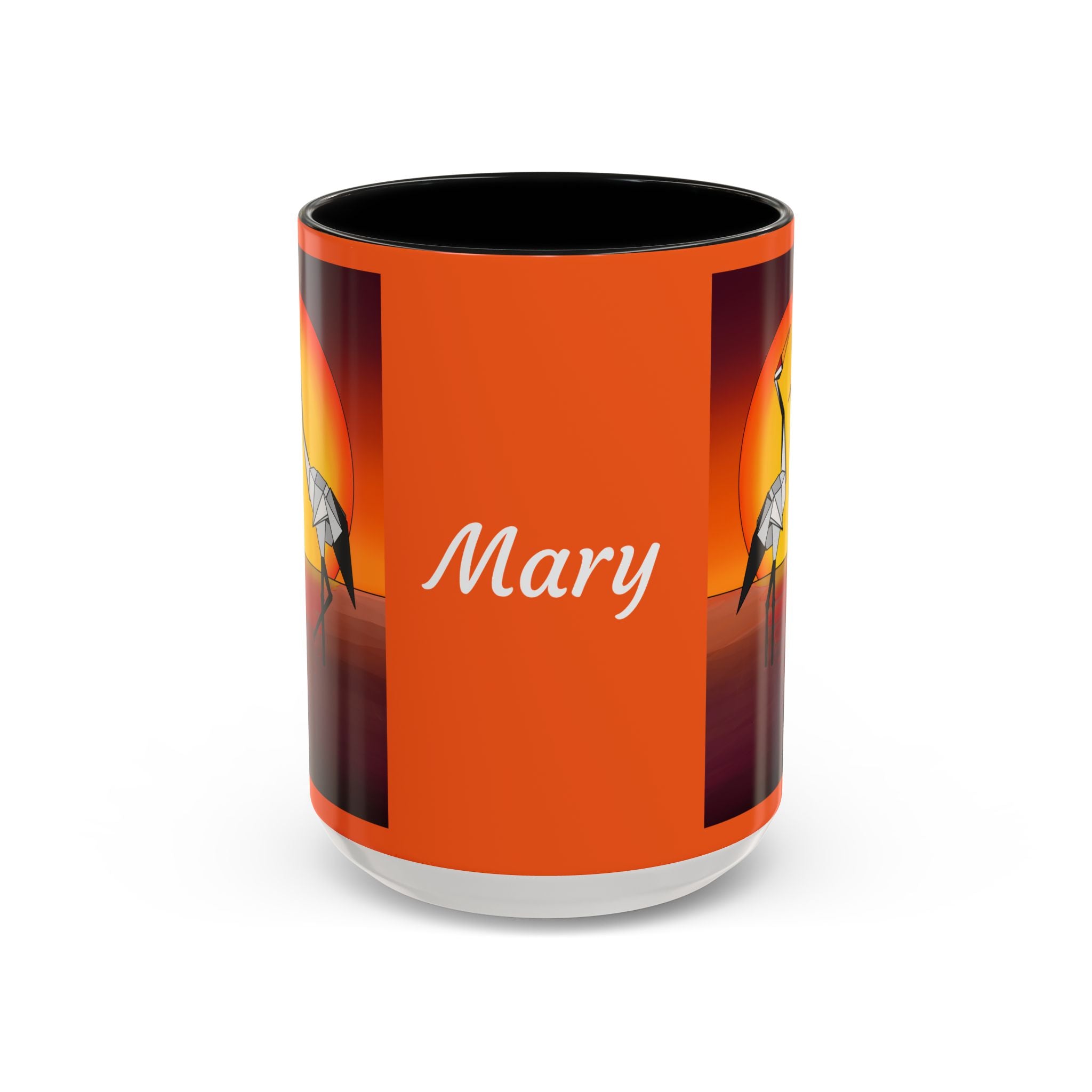 Orange coffee mug with “Mary” script, origami cranes on dark side panels, black rim