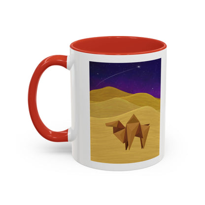 White coffee mug with red rim and handle, desert-night camel graphic over sand dunes
