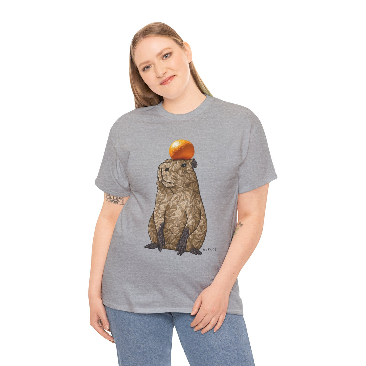 Unisex heavy cotton T-shirt in sport grey with centered capybara and orange fruit graphic