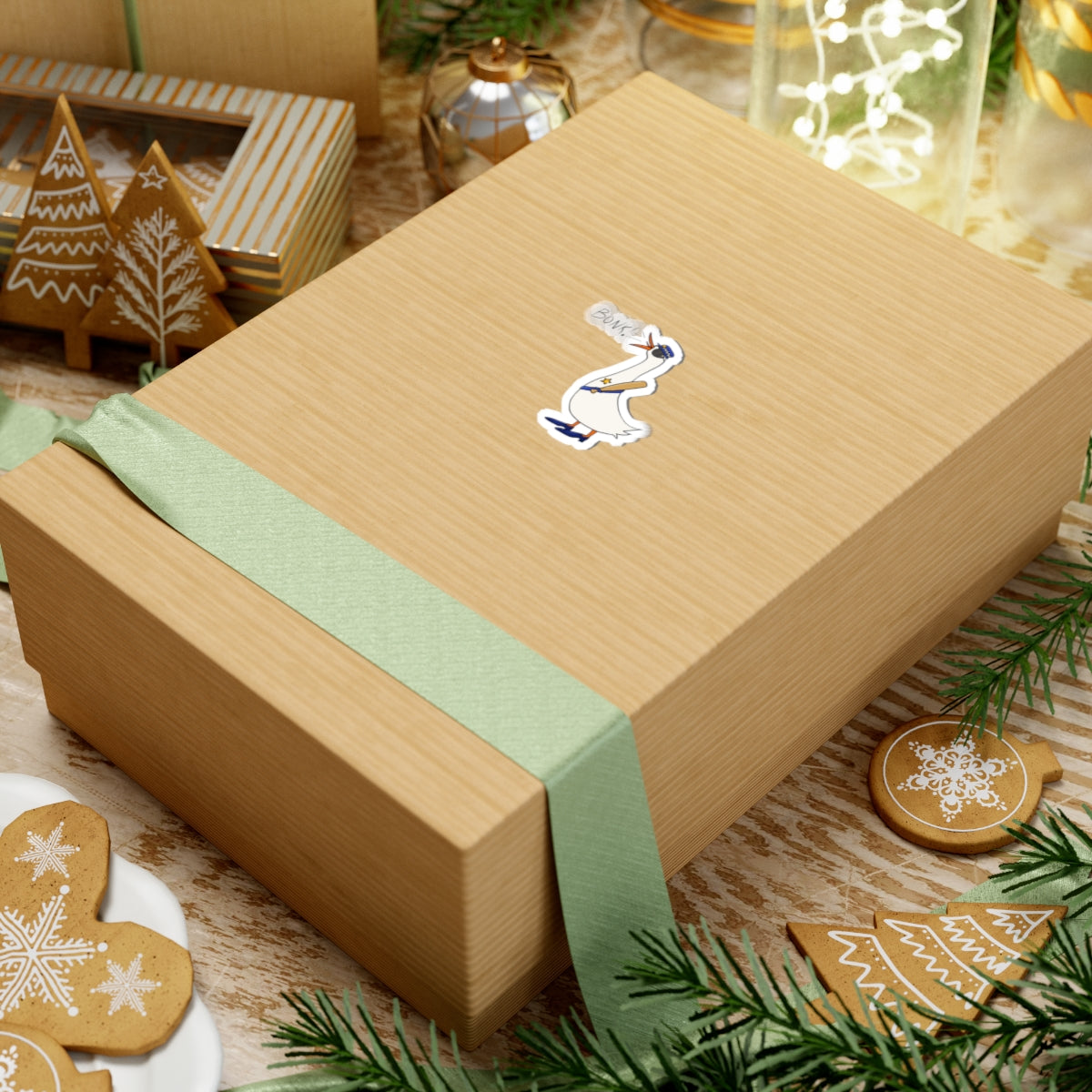 White kiss-cut goose sticker on a wrapped gift box