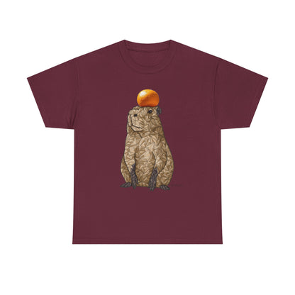 Maroon unisex T-shirt with capybara holding an orange graphic on front