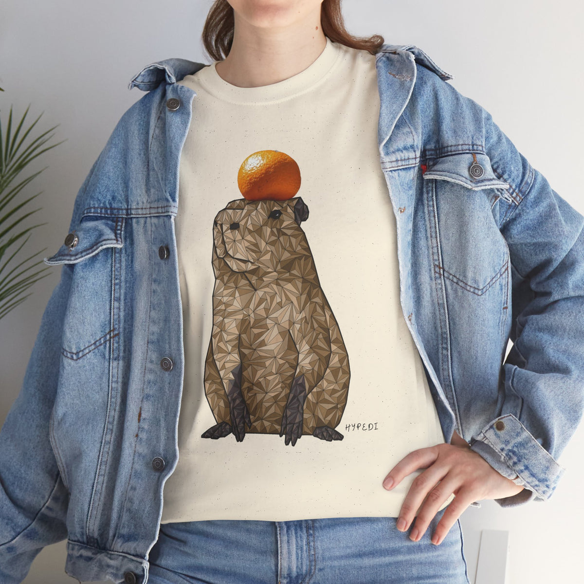 Unisex heavy cotton capybara t-shirt, cream, worn under blue denim jacket