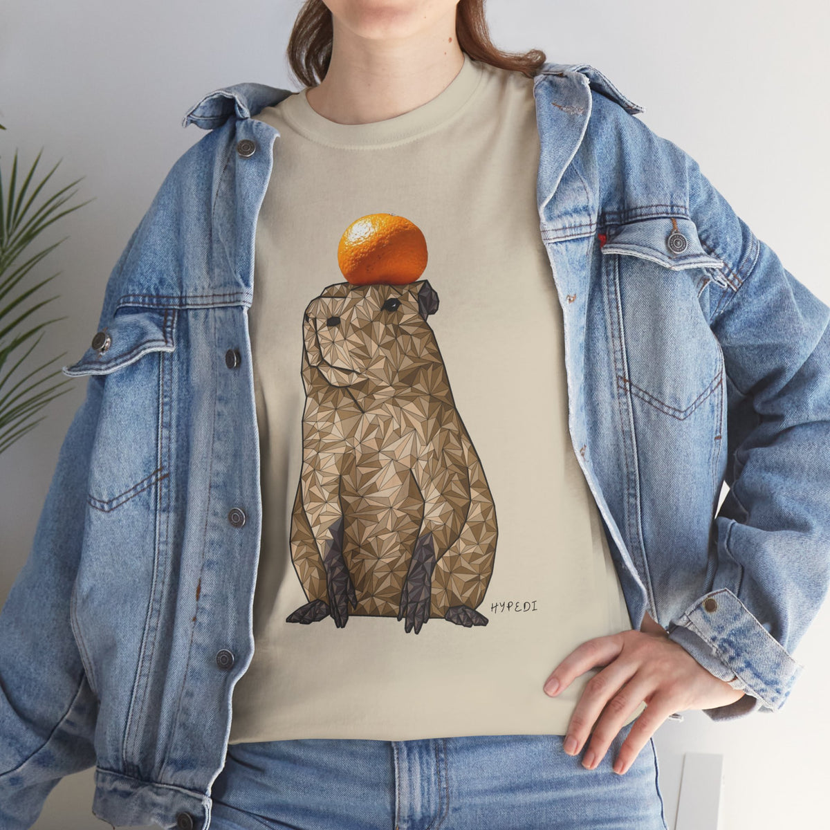 Unisex heavy cotton T-shirt in natural beige with capybara and orange fruit print