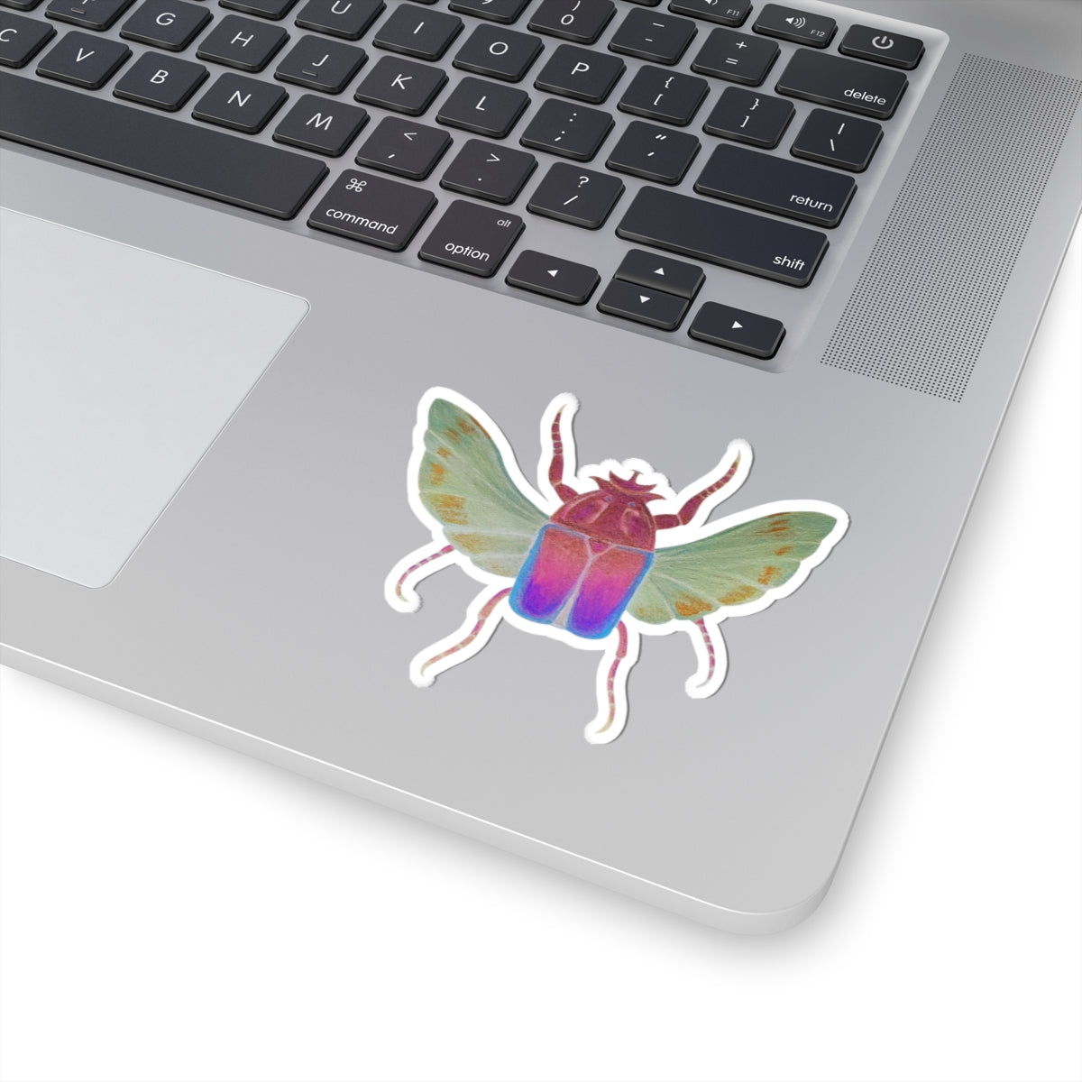 Small iridescent beetle kiss-cut sticker with rainbow body, wings, and white outline
