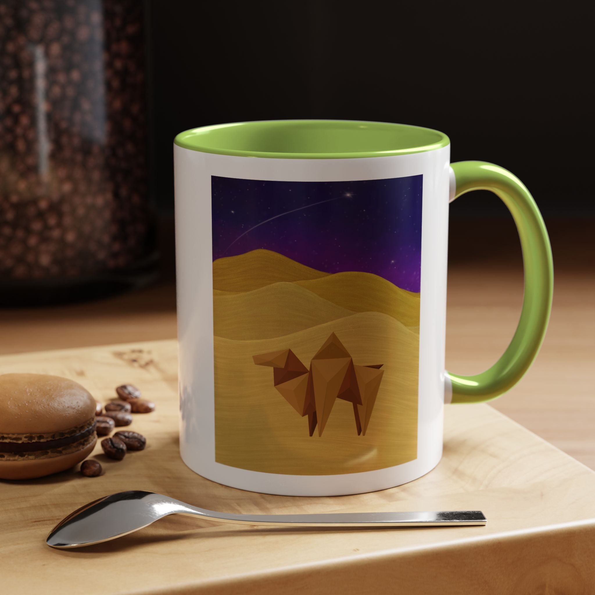 Coffee mug with night-sky origami camel, white with yellow-green handle and interior.