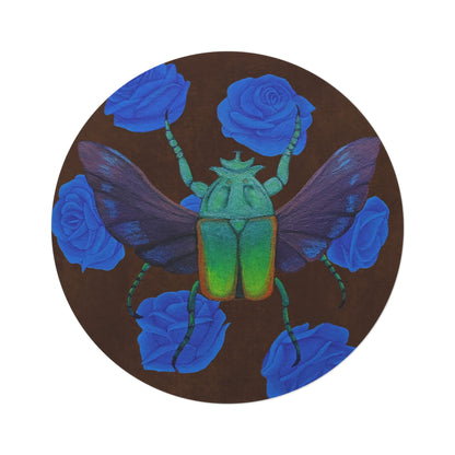 Round rug close-up: green beetle with blue roses on dark brown background