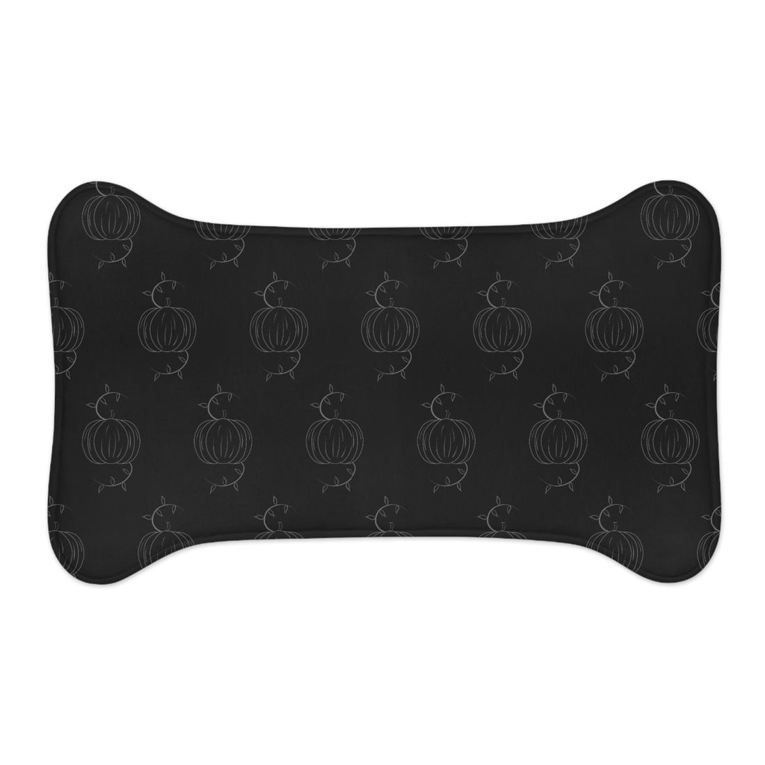 Black pet feeding mat with pumpkin outline pattern, arched oval shape