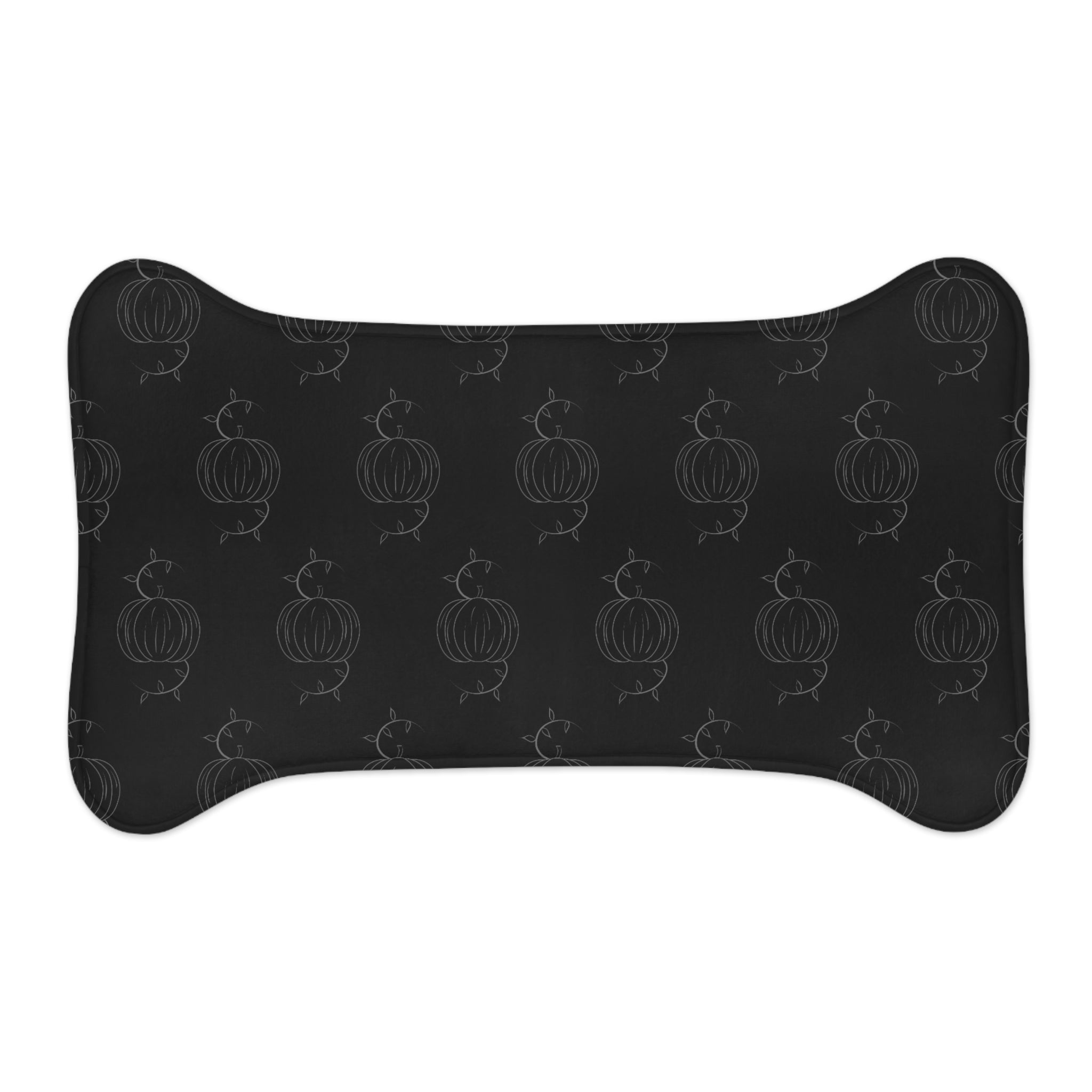 Black pet feeding mat with pumpkin outline pattern, arched oval shape