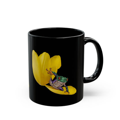Black ceramic mug with yellow tulip and frog graphic on the front