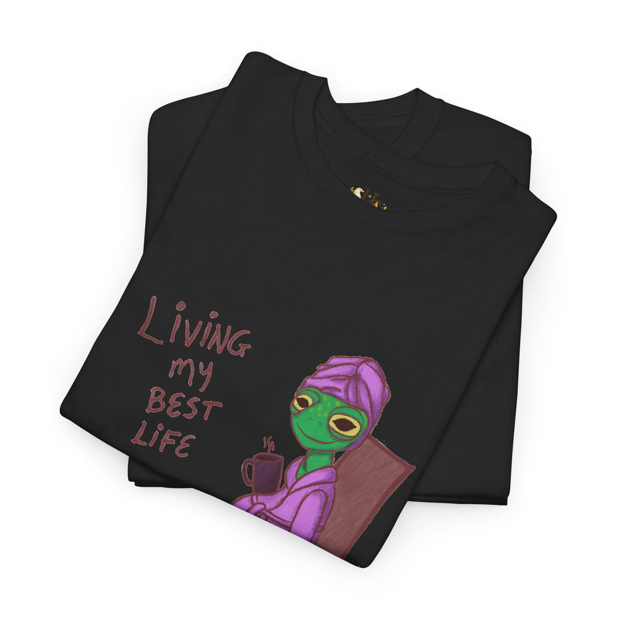 Black graphic t-shirt with “Living my Best Life” text and character artwork, folded