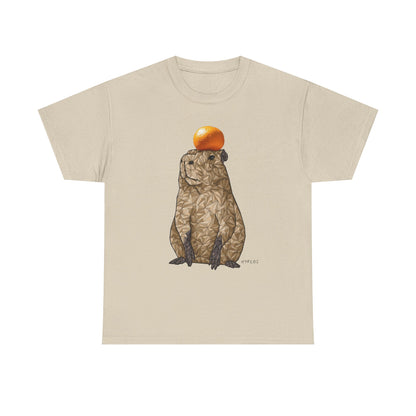 Natural/beige unisex T-shirt with capybara holding an orange graphic on front