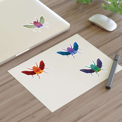 Die-cut sticker sheet with four colorful beetle stickers on cream paper