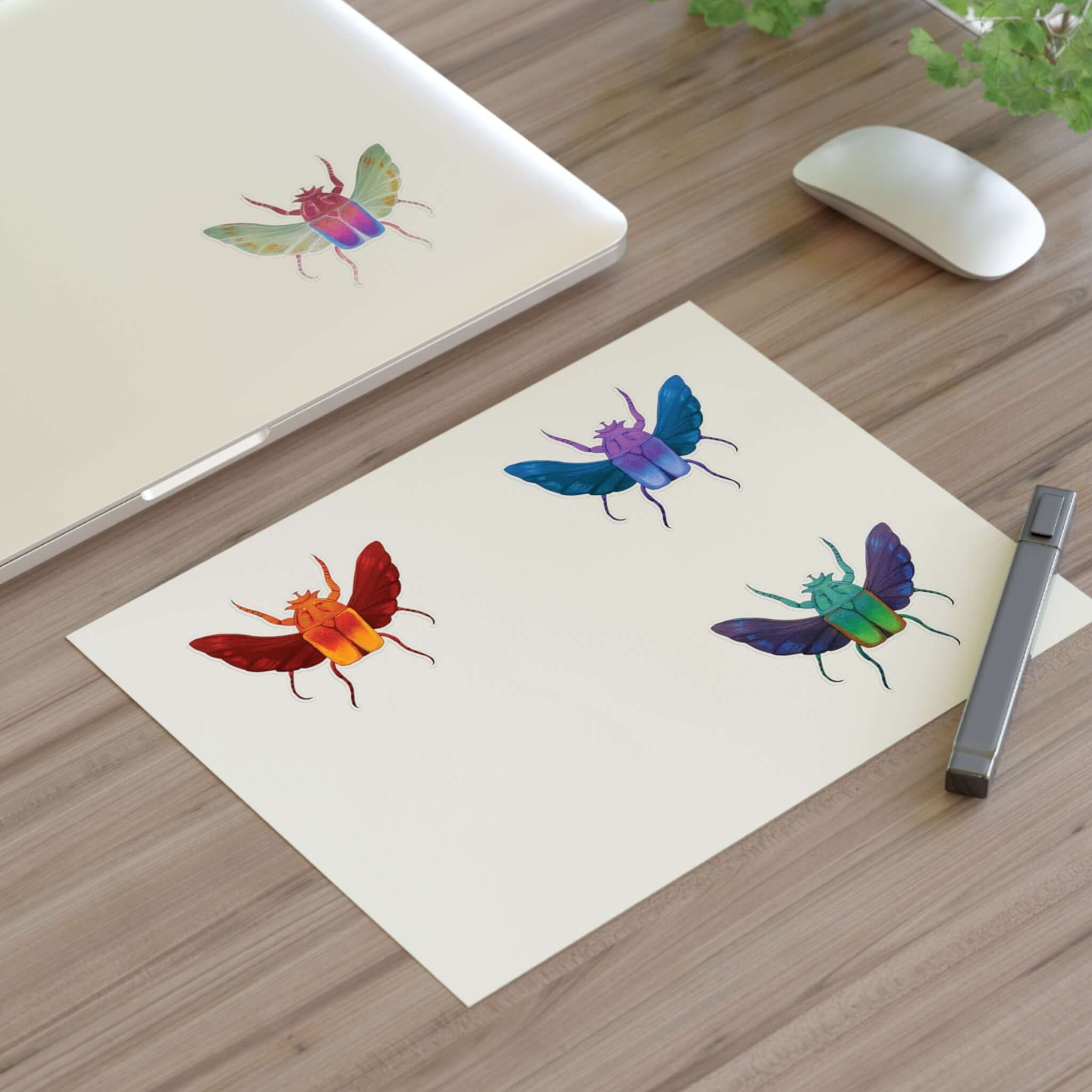 Die-cut sticker sheet with four colorful beetle stickers on cream paper