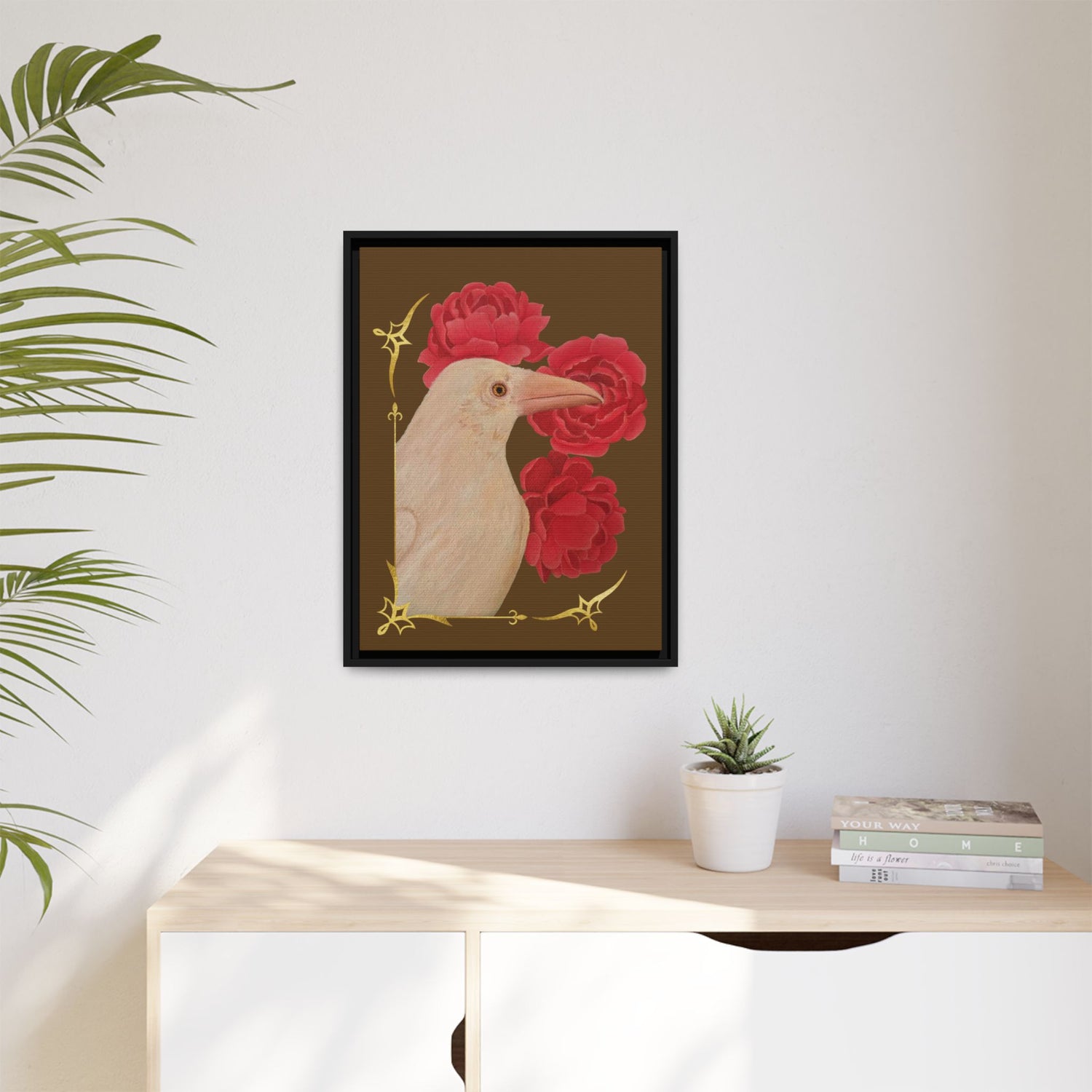 Small black framed canvas art print with a white raven and red peonies details.