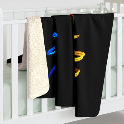Sherpa fleece blanket over railing with off-white fuzzy back and black parrot spirals