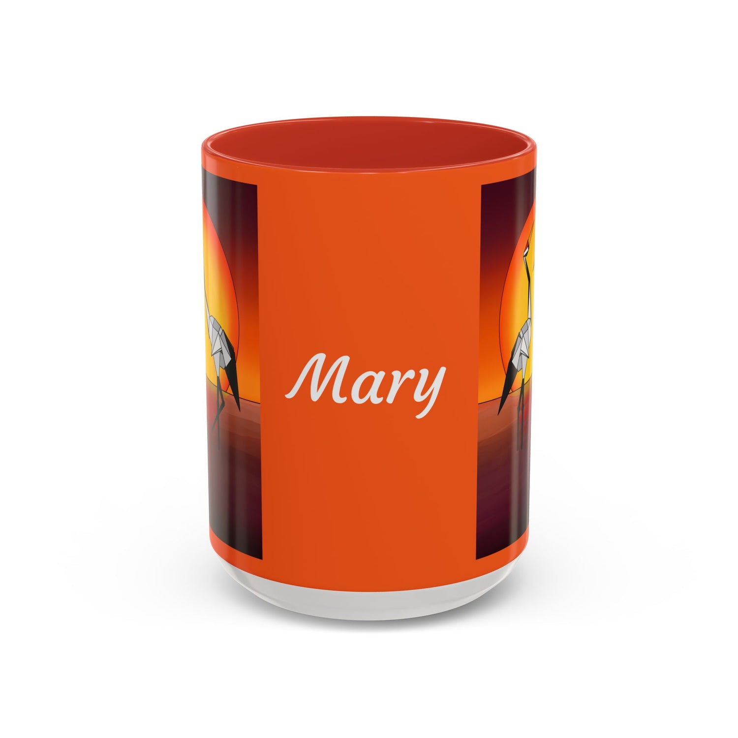 Orange coffee mug with red lid, “Mary” text and origami crane artwork on sides