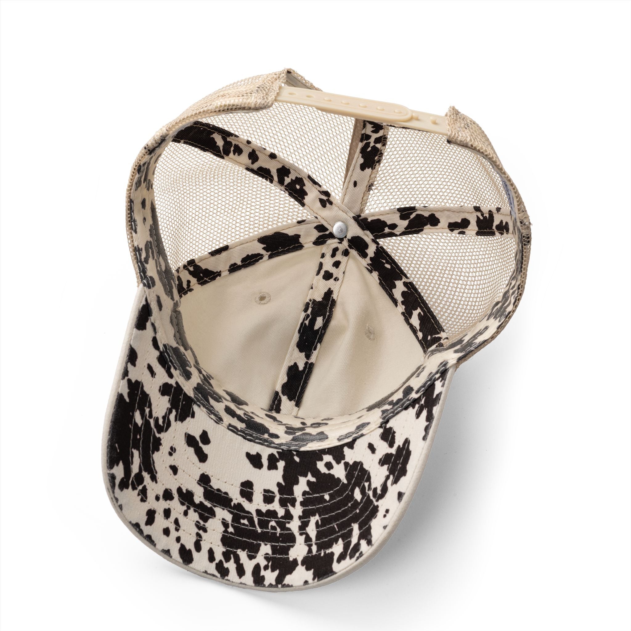 Washed mesh-back cap with black-and-cream cow print front panel