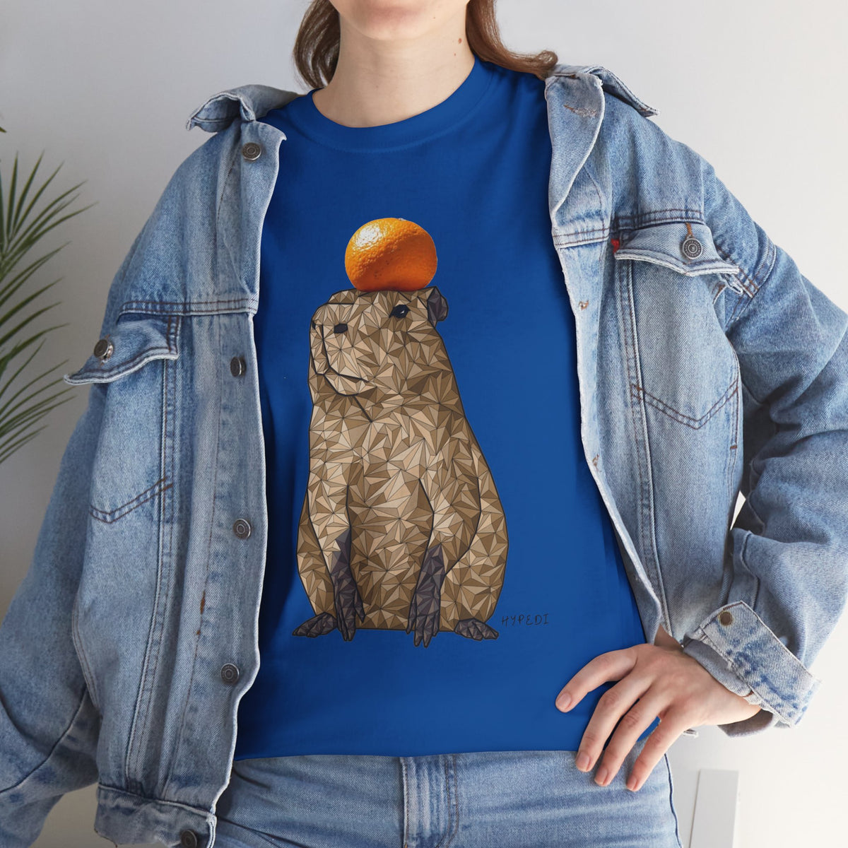 Royal blue unisex crewneck T-shirt with orange-capped capybara graphic