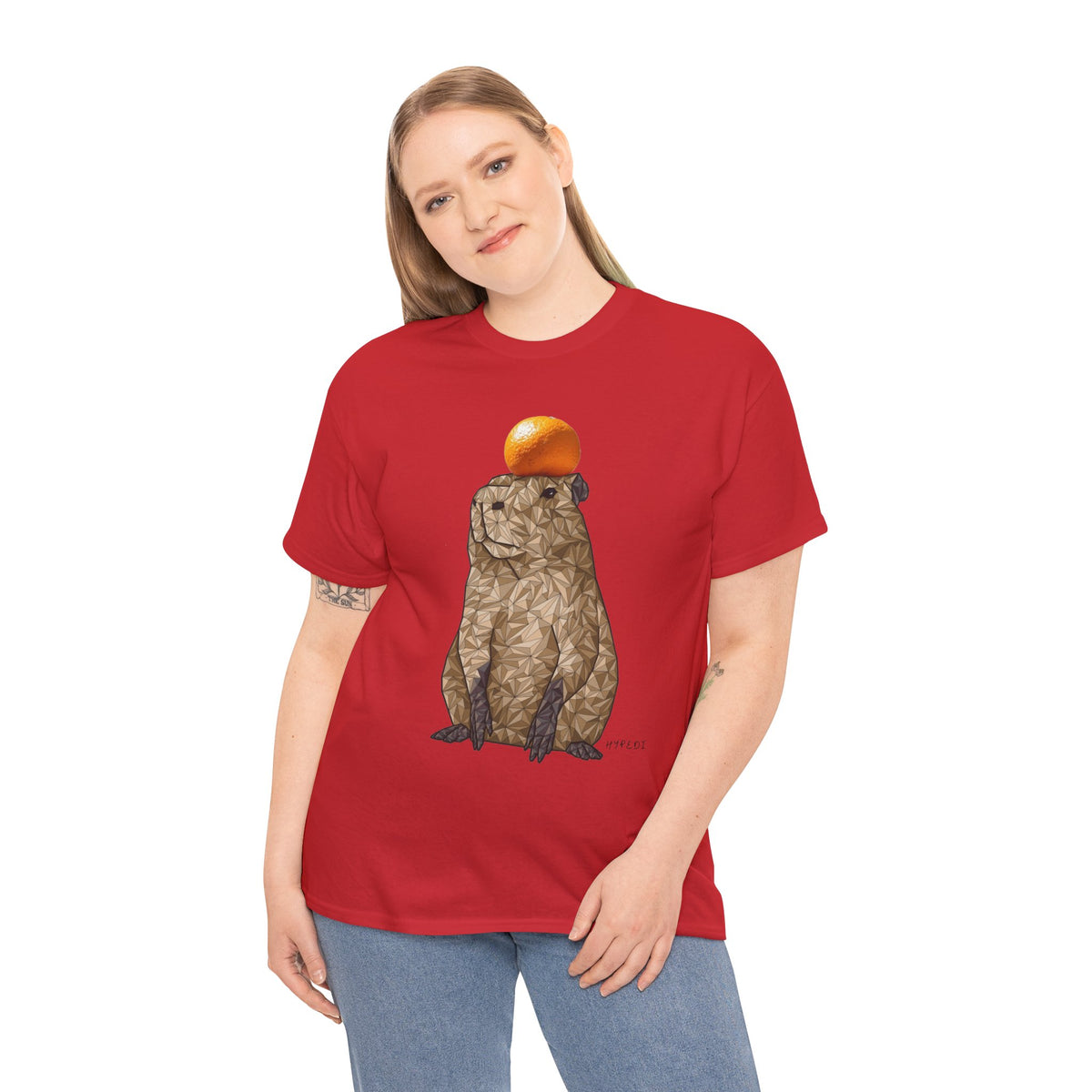 Red unisex T-shirt with centered capybara graphic holding an orange