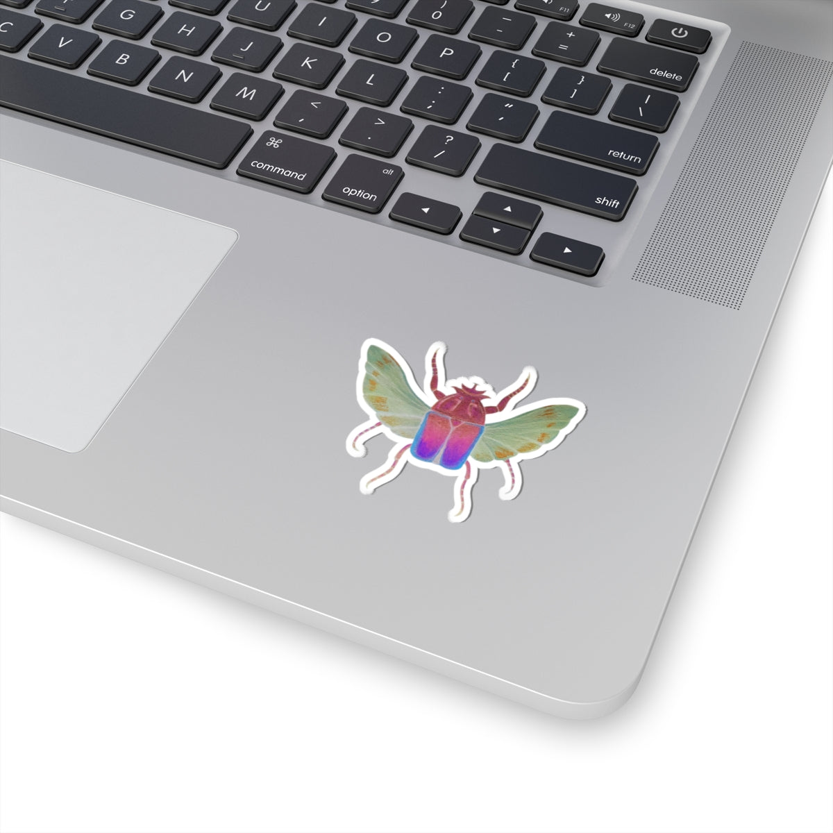 Iridescent beetle kiss-cut sticker with purple, green, and blue wings