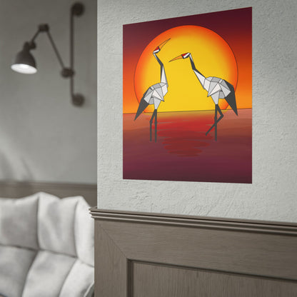 Framed sunset origami crane poster on a wall with two yellow birds and orange circle