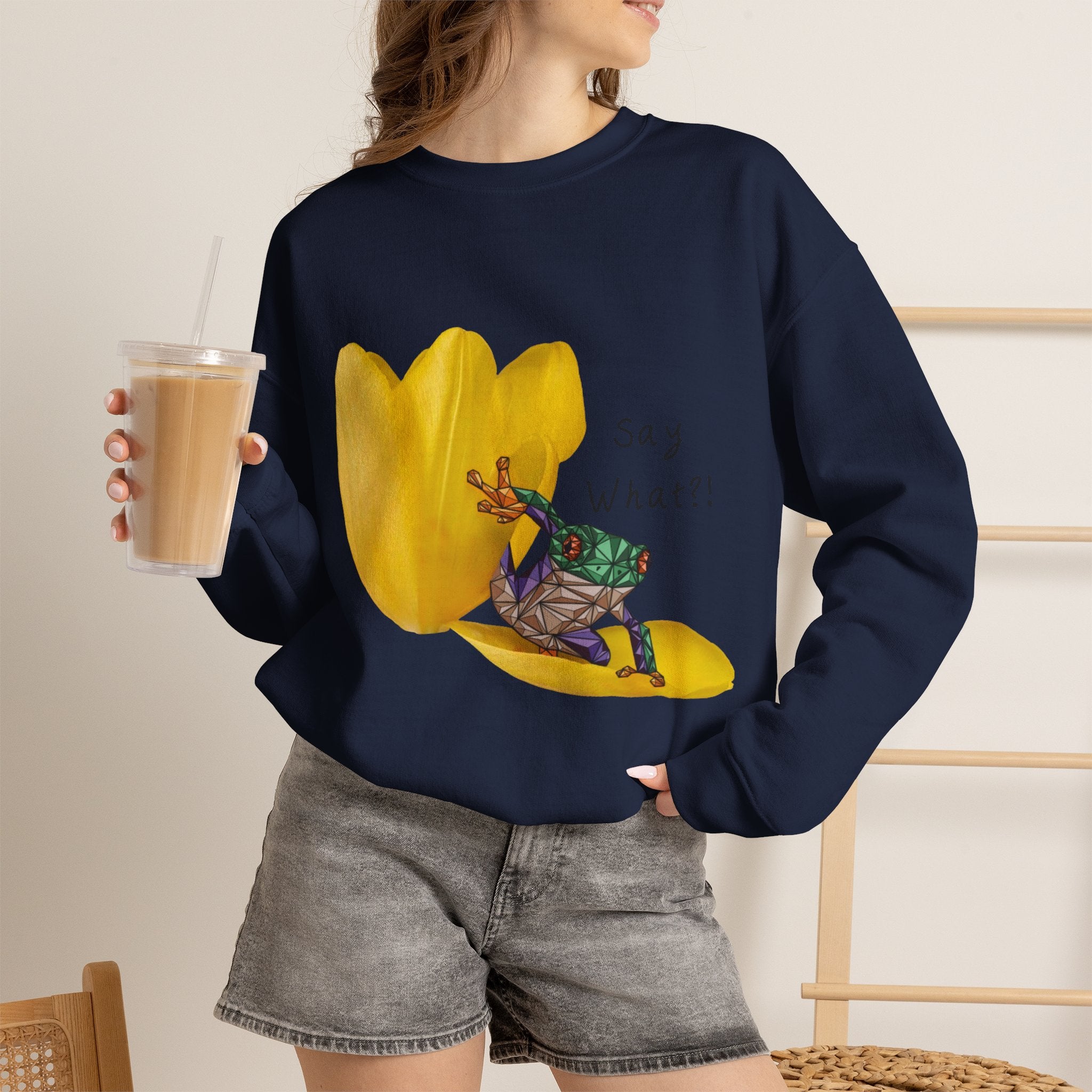 Navy crewneck sweatshirt on model with yellow tulip frog graphic and “Say What?!”