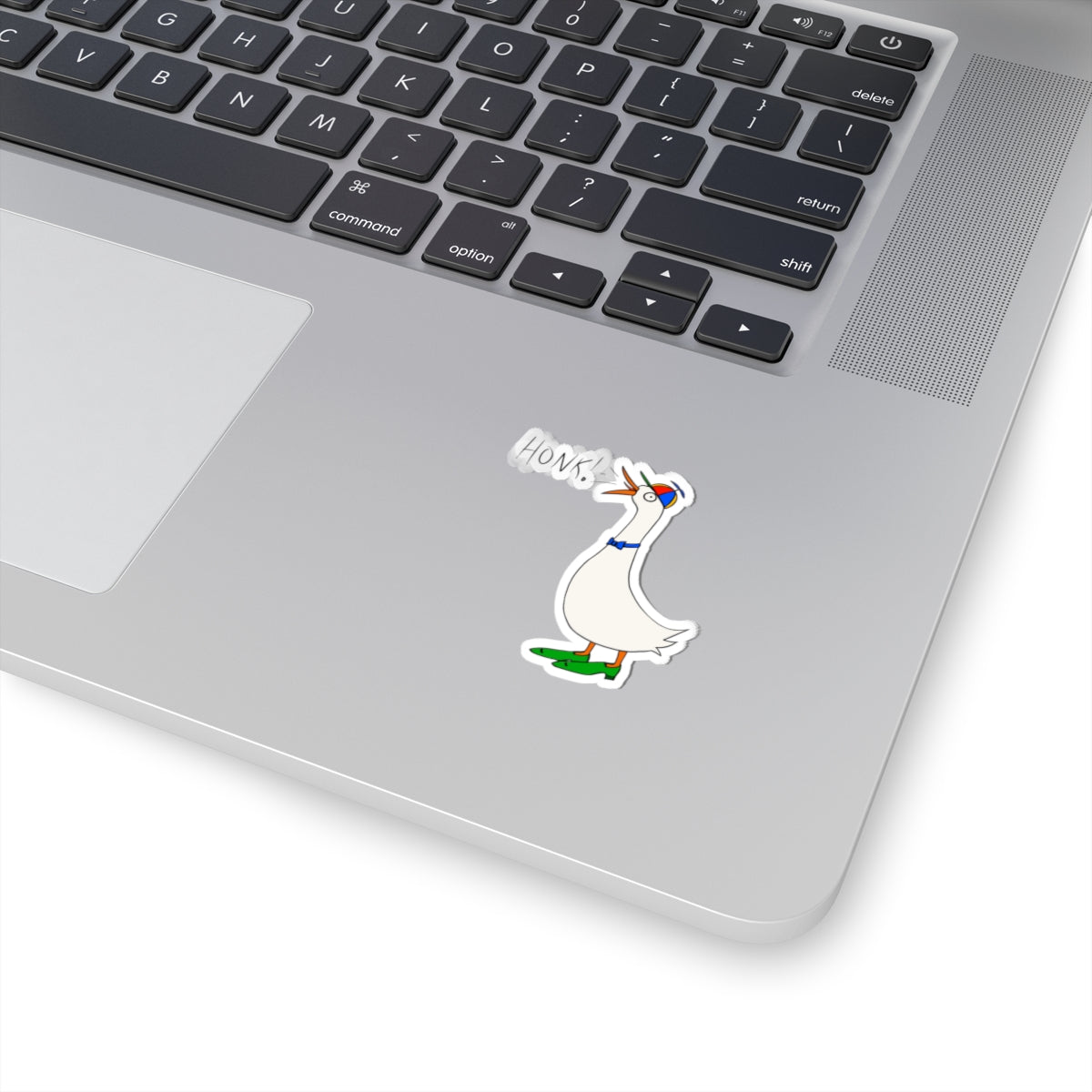 Goose cartoon kiss-cut sticker with “HONK!” text on a laptop