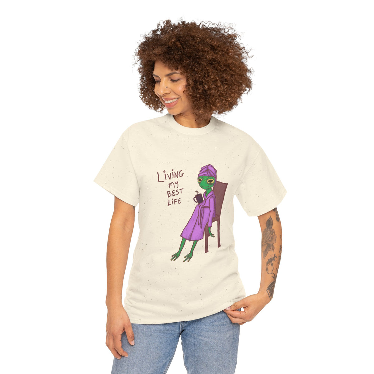 Cream graphic t-shirt on model with “Living my Best Life” character print