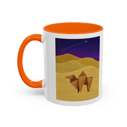 Coffee mug with orange handle and rim, white body, origami camel desert night sky scene