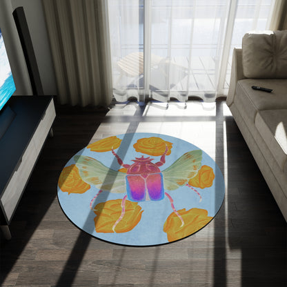 Round area rug with blue background, purple beetle and yellow rose accents