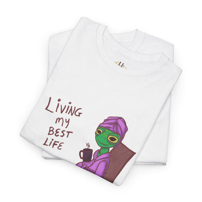 White graphic t-shirt with “Living my Best Life” text and character artwork, folded