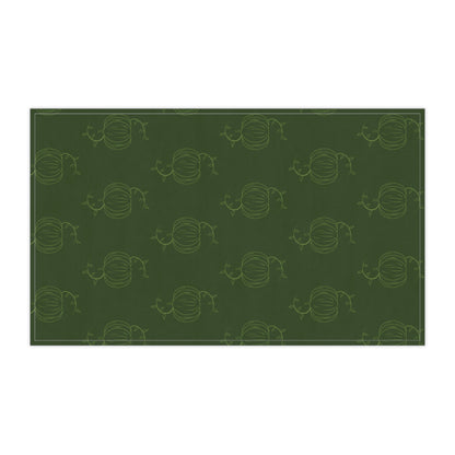 Green pumpkin patterned tea towel, horizontal rectangle with stitched border