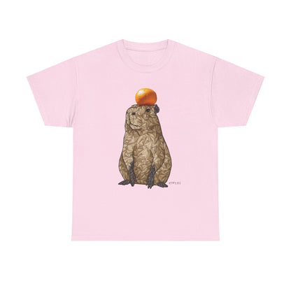 Unisex heavy cotton t-shirt in light pink with capybara and orange hat graphic on front