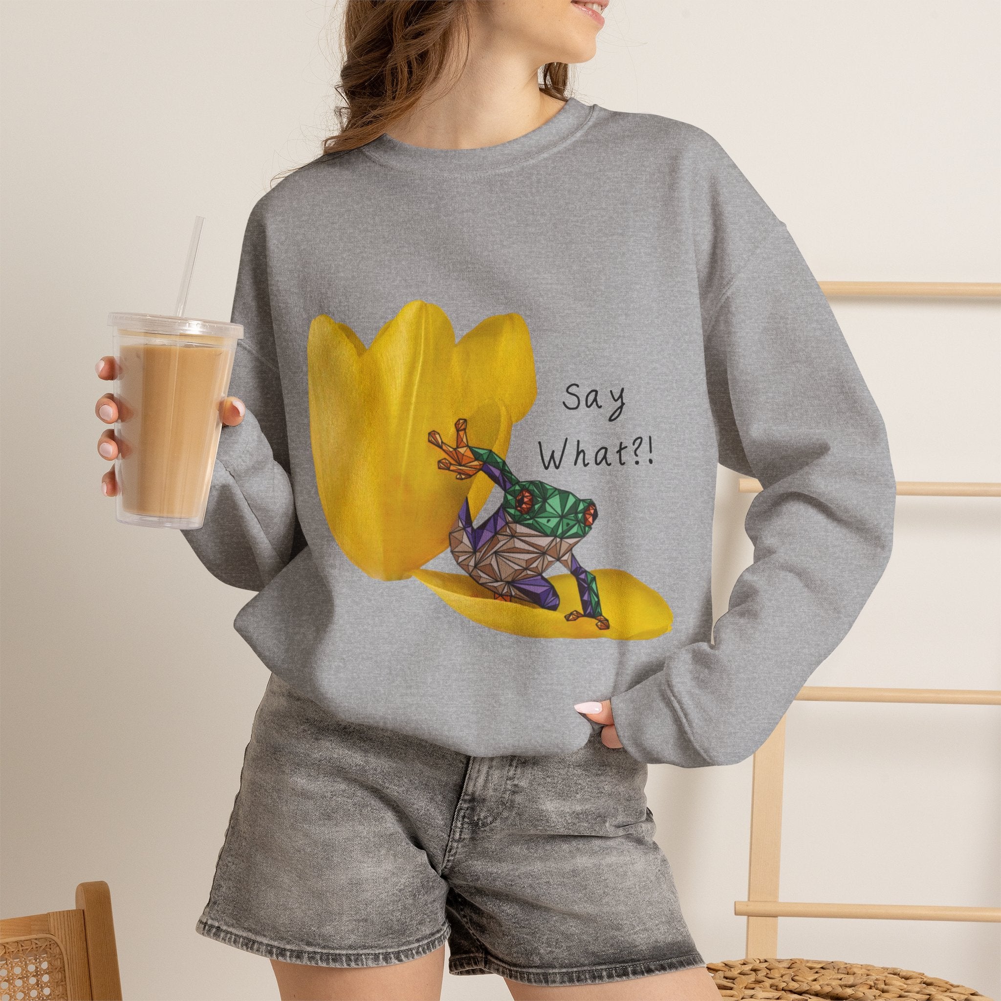 Crewneck sweatshirt in dark heather gray with yellow tulip frog graphic and “Say What?!”