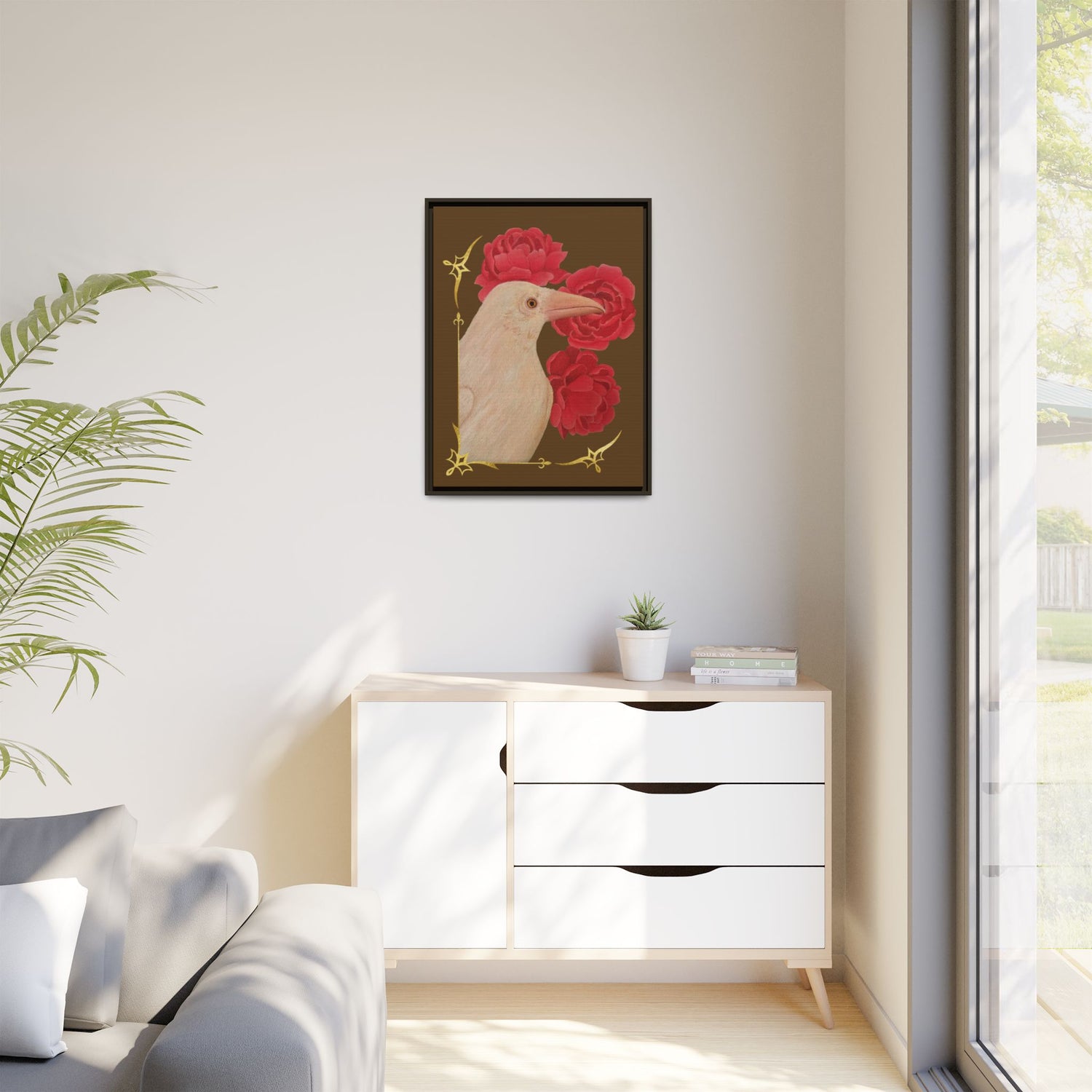 Black framed canvas art print with a white raven and red peonies flowers.