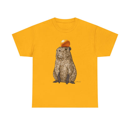 Gold unisex T-shirt with capybara holding an orange graphic on front