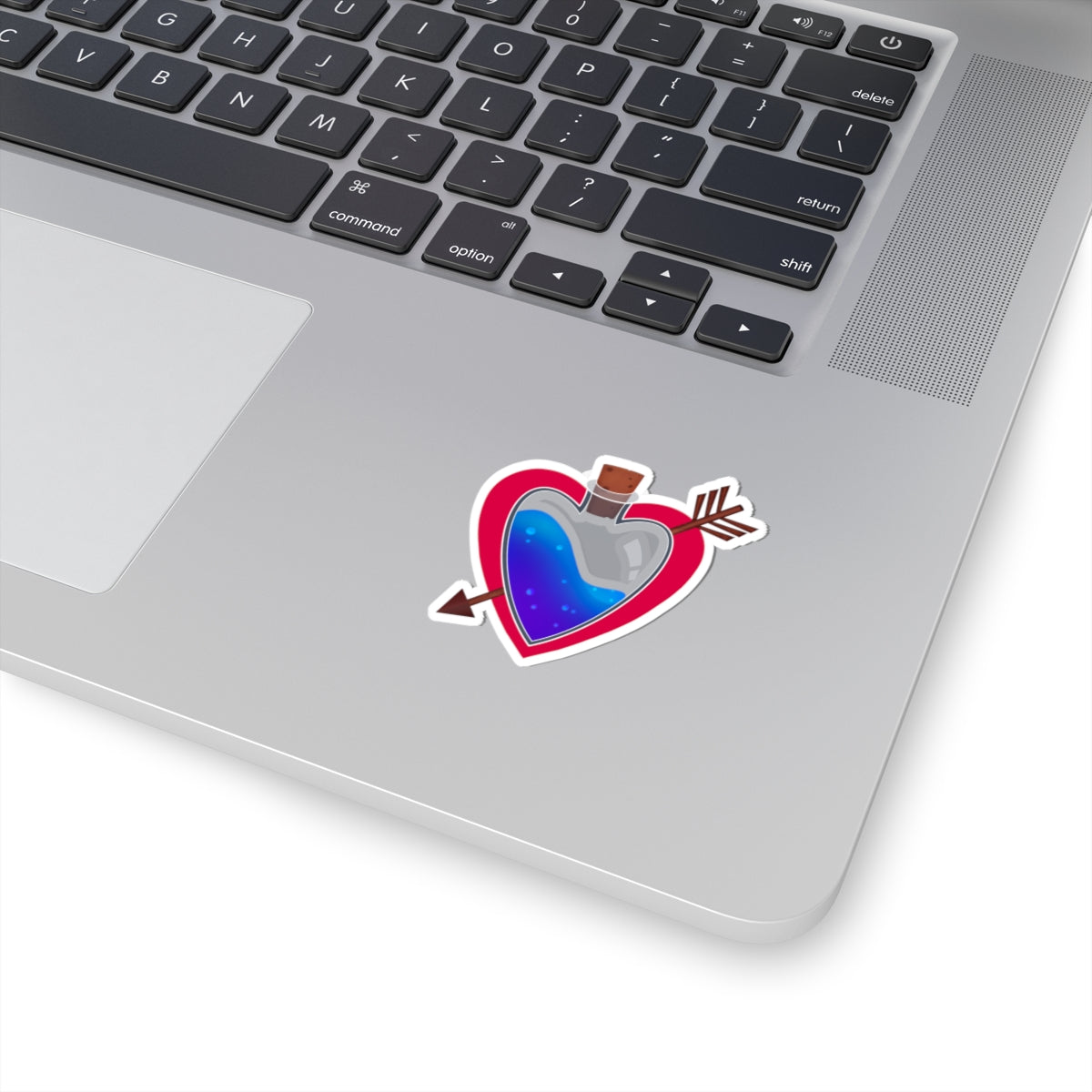 Heart-shaped kiss-cut vinyl sticker with blue heart, red outline, arrows and wings