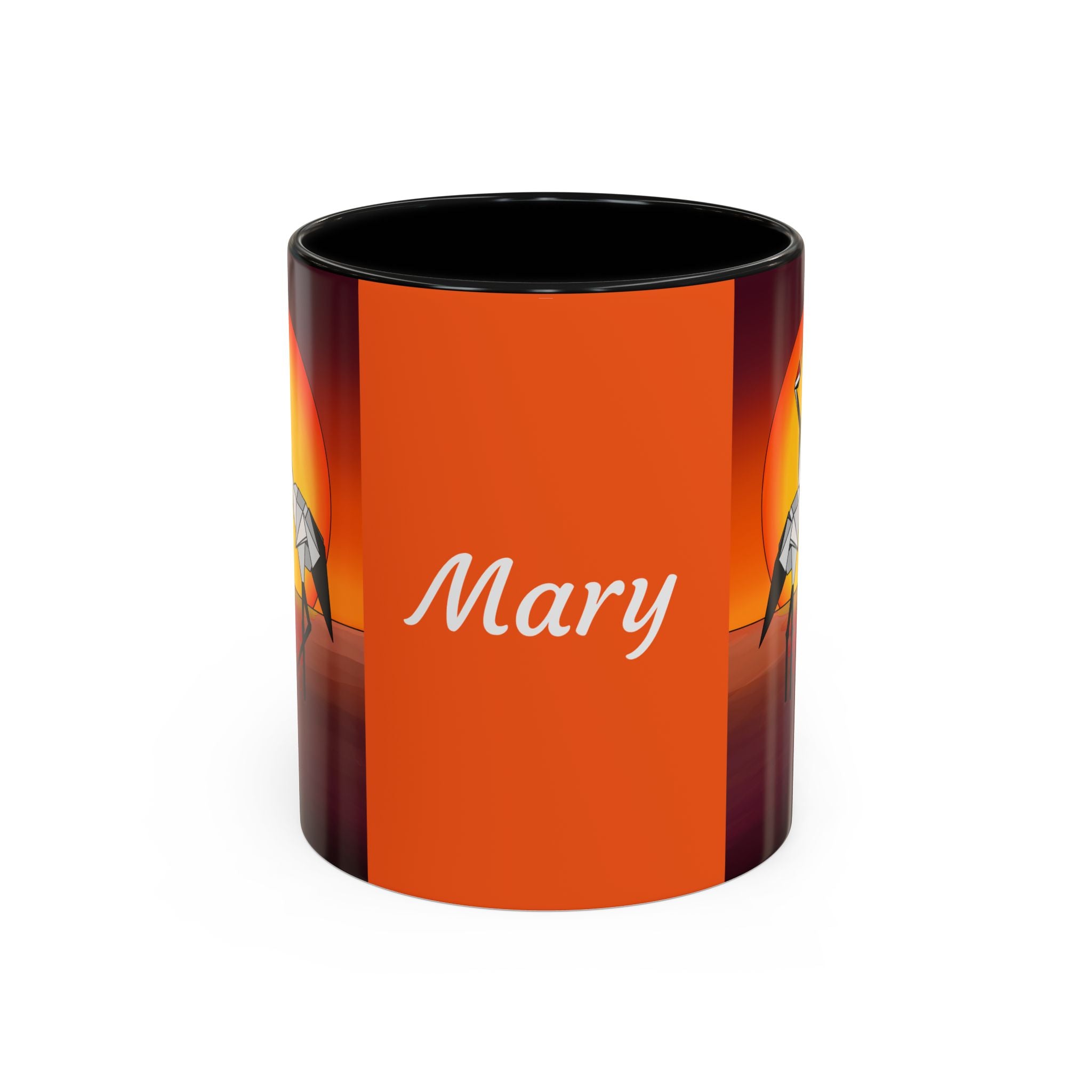 Orange coffee mug with black rim, “Mary” script and origami crane artwork