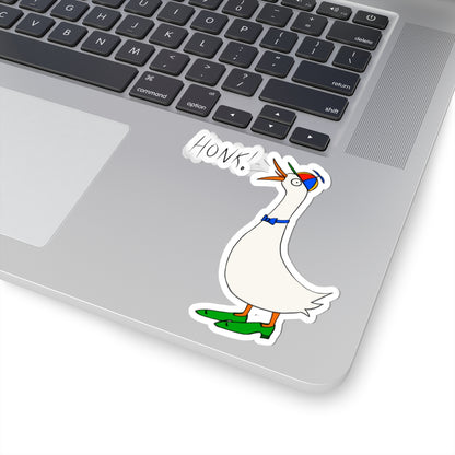 Goose “HONK!” sticker on laptop keyboard, die-cut outline around the character