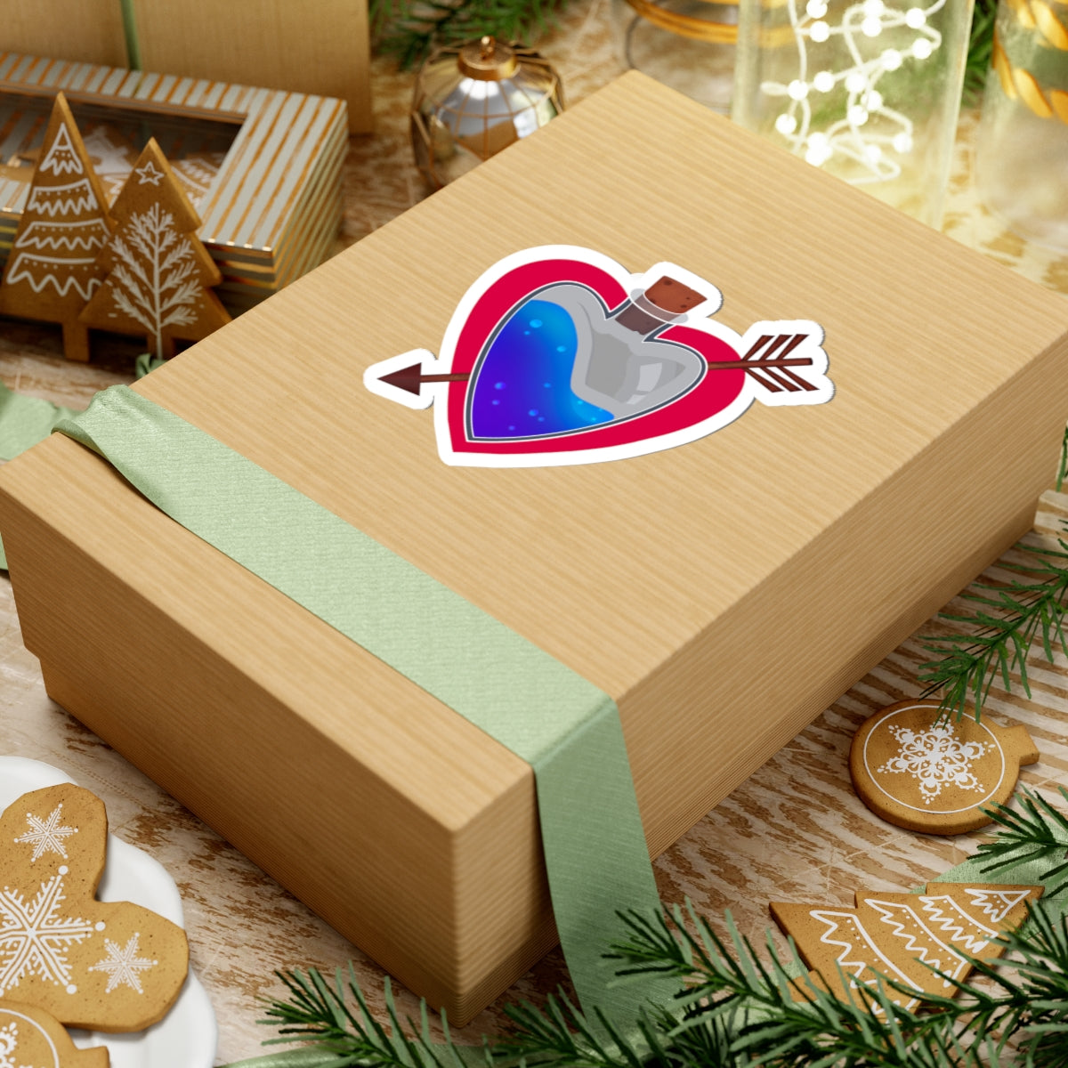 Heart potion sticker on a wrapped gift with green ribbon and holiday ornaments