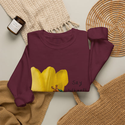 Maroon crewneck sweatshirt laid flat with yellow tulip frog graphic and “Say What?!” text