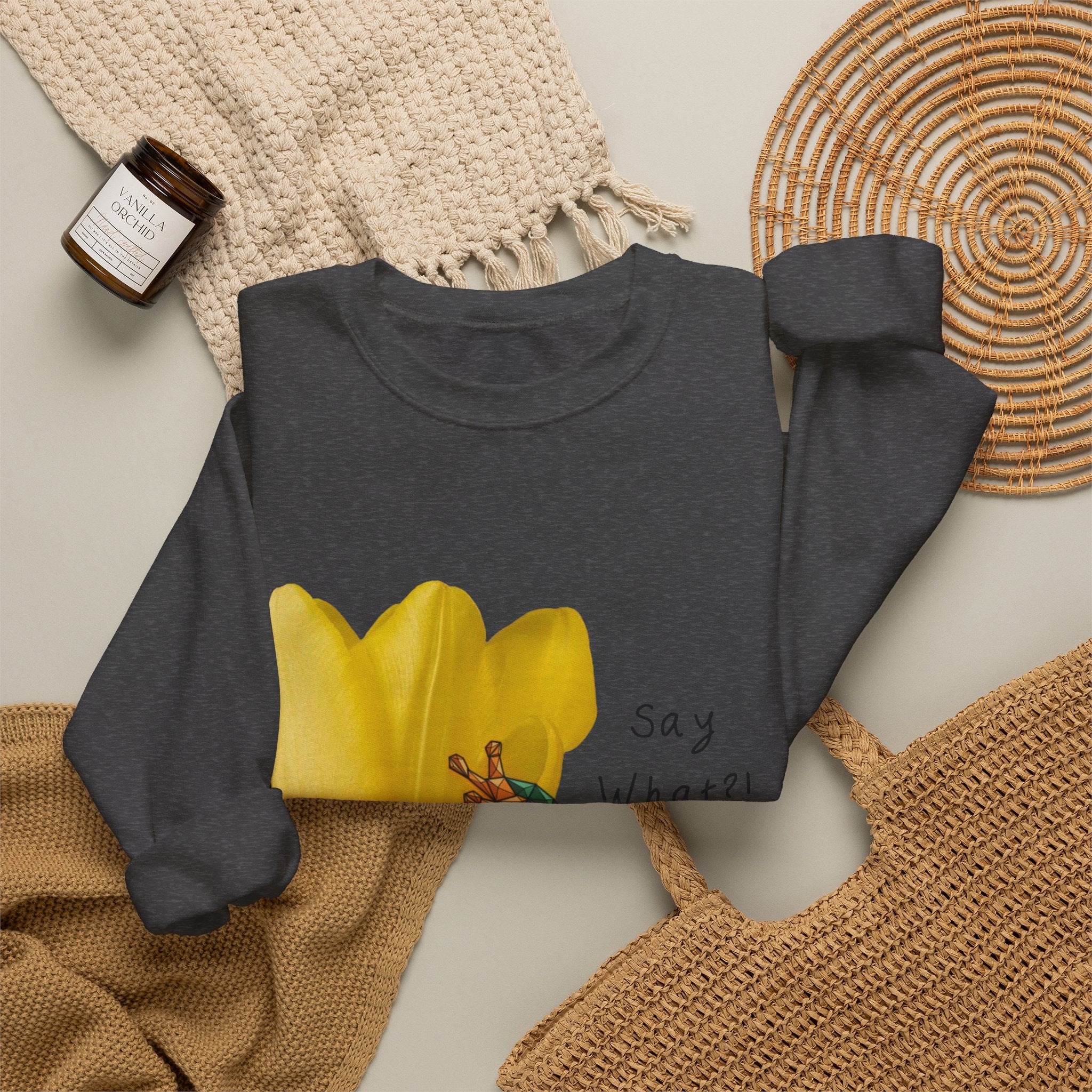Dark heather gray crewneck sweatshirt laid flat with yellow tulip frog graphic